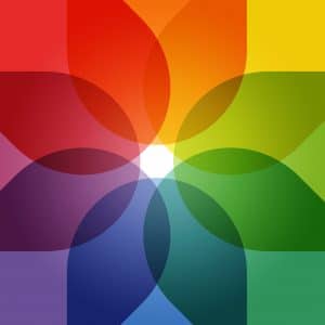 A vibrant, overlapping geometric design featuring petal-like shapes in the colors of the rainbow. Each shape blends with adjacent ones, creating a dynamic, multicolored pattern with a bright white center. The overall effect is visually engaging and perfect for privacy-conscious social media photos.