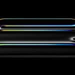 A sleek iPad Pro with a glossy, black surface and an OLED screen displays three curved, colorful neon lines glowing against the dark background. The lines radiate hues of blue, yellow, red, and green, creating a vibrant, futuristic design powered by the advanced M4 Chip.