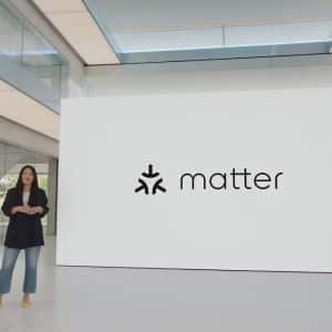 Smart home setup with Matter 1.4.1, showing an iPhone using the Apple Home app to configure a Matter-compatible smart light via QR code scanning.
