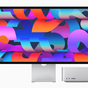 Concept illustration of an Apple high-end monitor displaying a vibrant 7K resolution screen, featuring Apple Silicon and a sleek design, positioned alongside a Mac Pro on a modern desk.