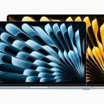 Two laptops are shown side by side with their screens displaying abstract designs, reminiscent of severance in their contrasting themes. The front laptop showcases a blue pattern, while the back one displays a yellow design. Both devices boast a sleek, modern look against a white background.