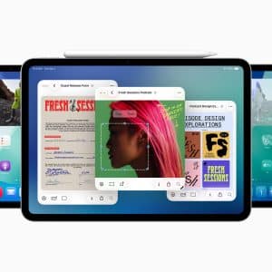 Three iPads running iPadOS 26 display different multitasking screens; the center shows overlapping windows, the left features the home screen, and the right shows control center settings. An Apple Pencil rests on top.