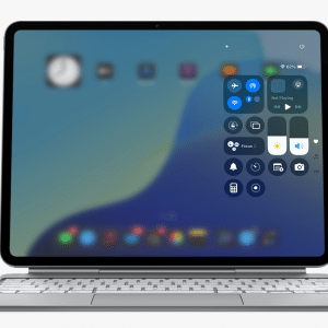 A tablet with a keyboard attached displays a blurred home screen and Control Center, showcasing icons and controls. The Apple logo appears in the top right corner of the image.