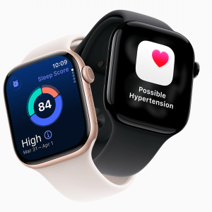 Two smartwatches display health apps; one, resembling an Apple Watch, shows a sleep score of 84 with sleep data, while the other displays a heart icon and the alert “Possible Hypertension,” demonstrating helpful Hypertension Alerts. The bands are white and black.