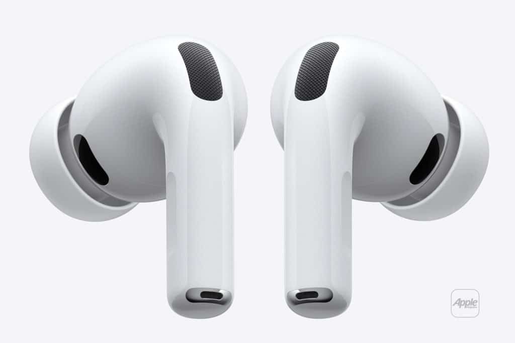 A pair of white wireless earbuds with silicone ear tips, featuring a sleek, rounded design and small black speaker grilles. The earbuds are positioned vertically side by side on a plain white background.