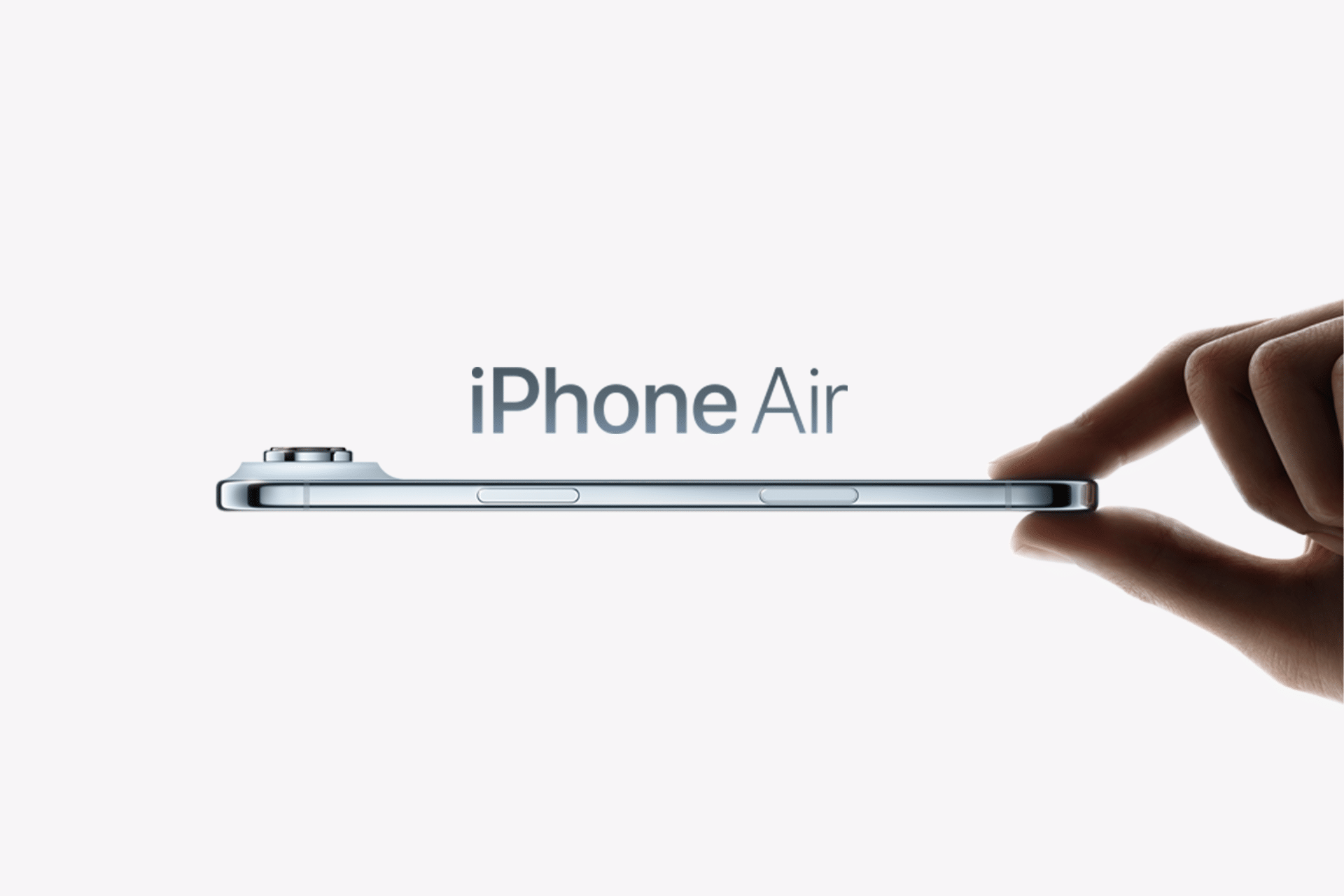 A hand holds a thin smartphone horizontally, with "2026 iPhone Air" displayed above the device against a plain, light background, highlighting its sleek design and dual-lens camera.