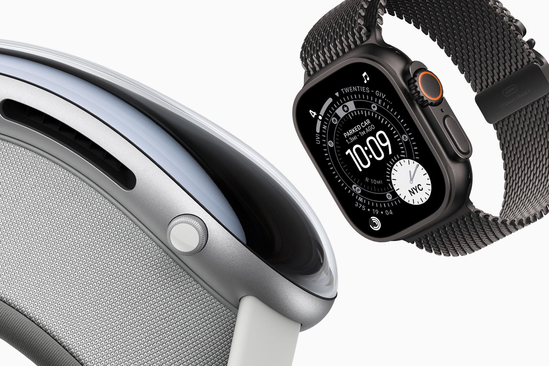 A close-up of a silver Apple Vision Pro headset next to a black Apple Watch with a woven band, both shown against a white background, celebrating Apple 50 years of innovation.