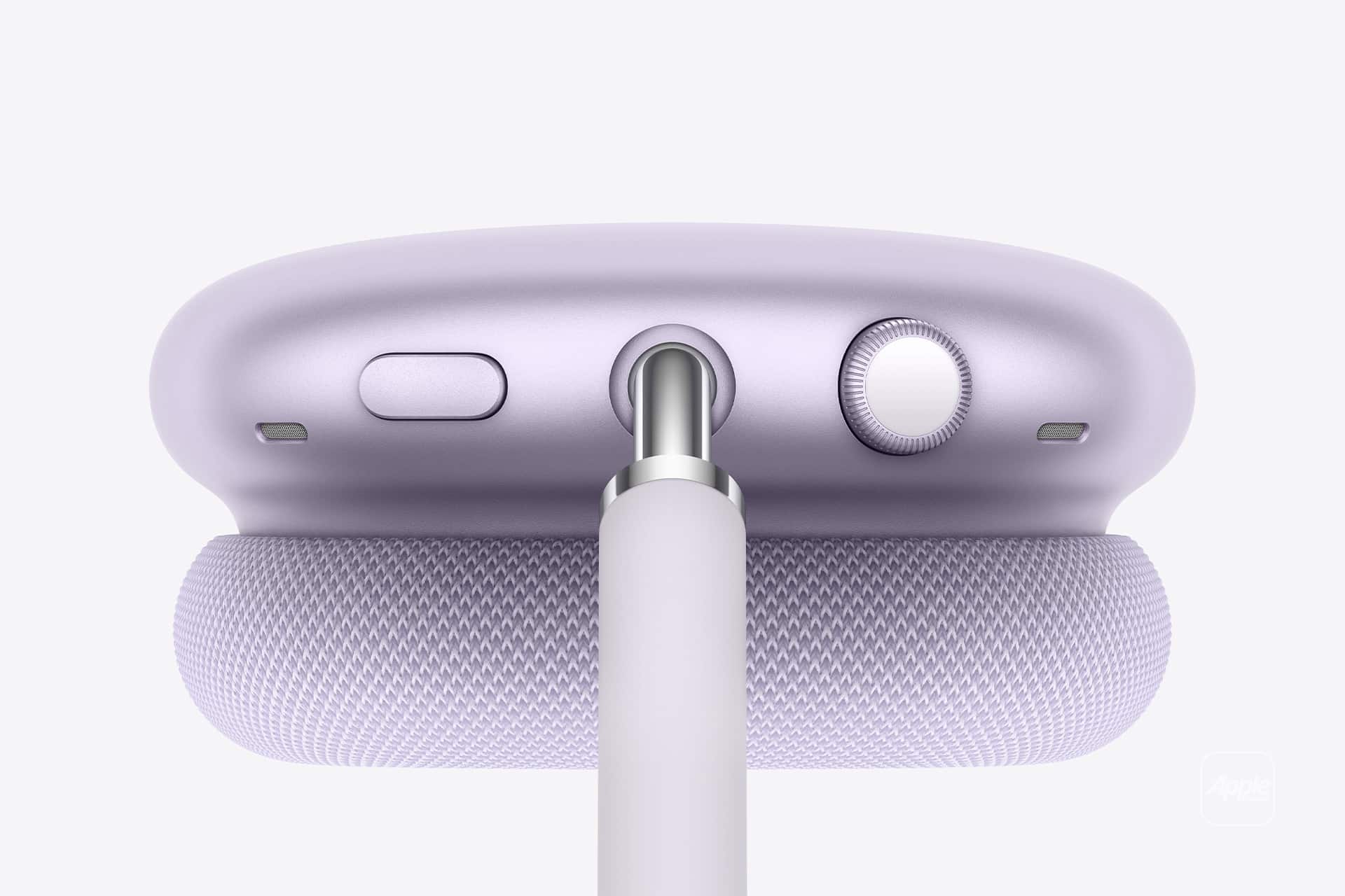 Close-up of a lavender Apple device, likely AirPods Max, showing the top with a mesh headband, buttons, a dial, and a cable plugged into the center port—perfect for tracking charge with AirPods Battery Widgets.