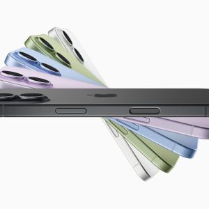 Several iPhones are shown in a fan arrangement, displaying different colors including black, green, yellow, pink, blue, and white—highlighting the vibrant options driving strong iPhone 17 demand. The rear camera and side buttons are also visible.