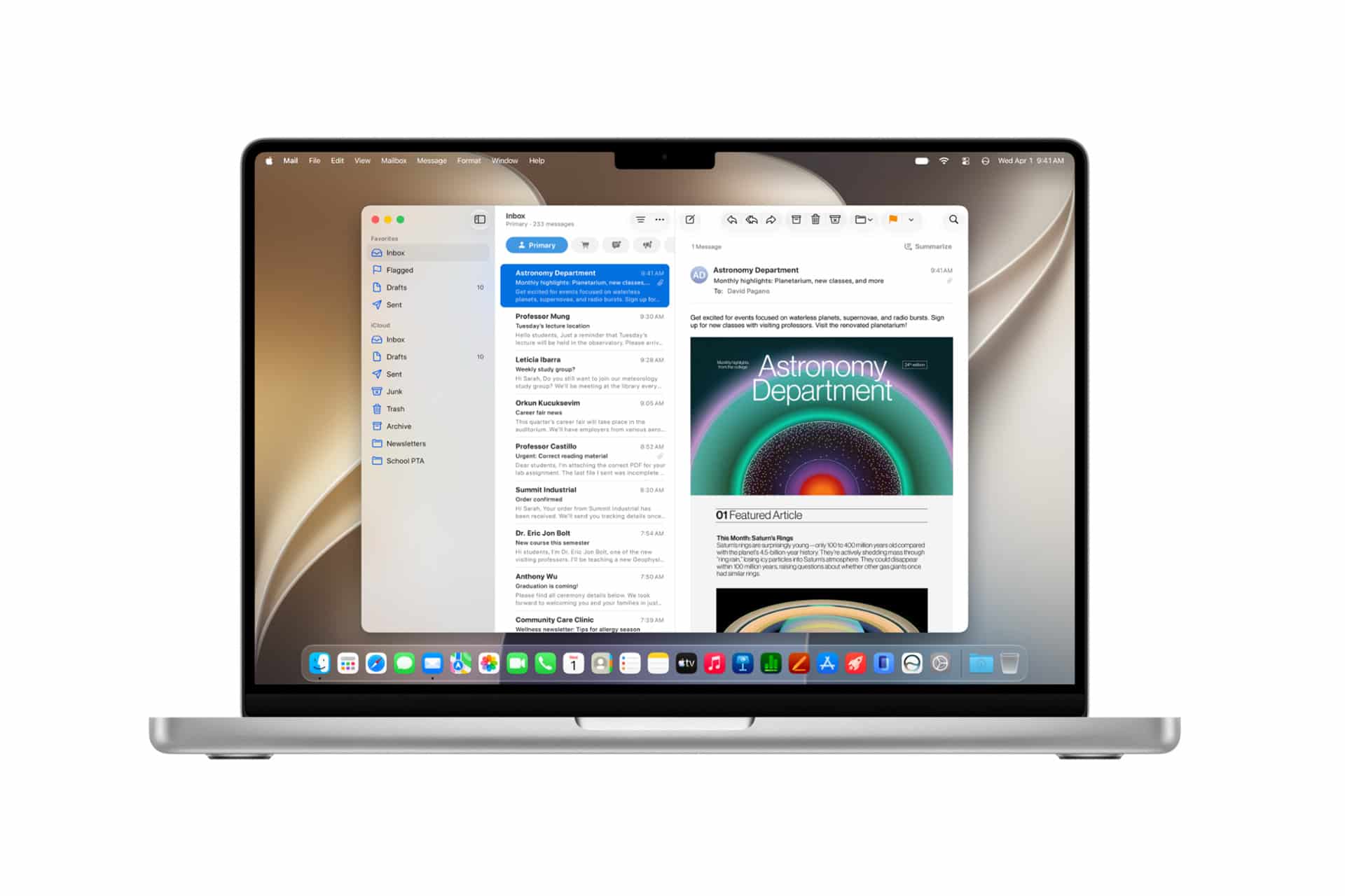 macOS 27 beta - A laptop displays the Apple Mail app open on the screen, showing a list of emails and one with the subject "Astronomy Department" and colorful graphics, all running seamlessly with macOS 27 compatibility. The desktop features a light, abstract wallpaper.
